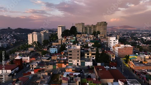 Aerial view of colorful ghetto houses and condominium, dusk in Naucalpan, Mexico photo