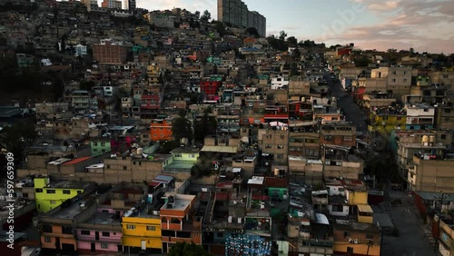 Aerial view over colorful, favela dwellings, sunset in Naucalpan, Mexico city photo