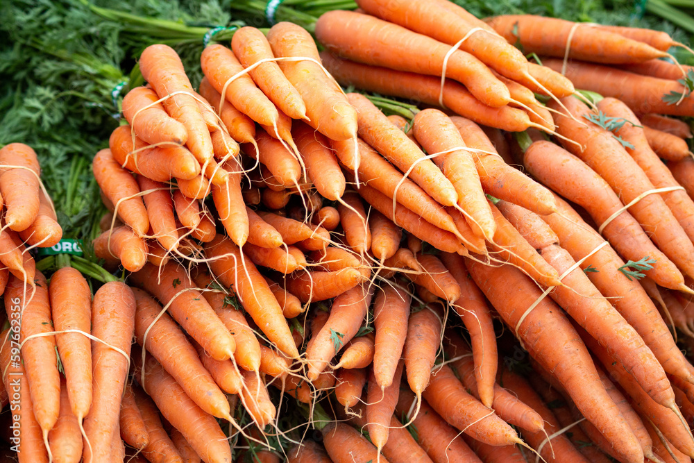 Pile of orange carrots at farmers market Pile of orange carrots at farmers market