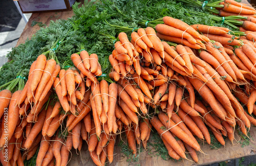 Pile of orange carrots at farmers market