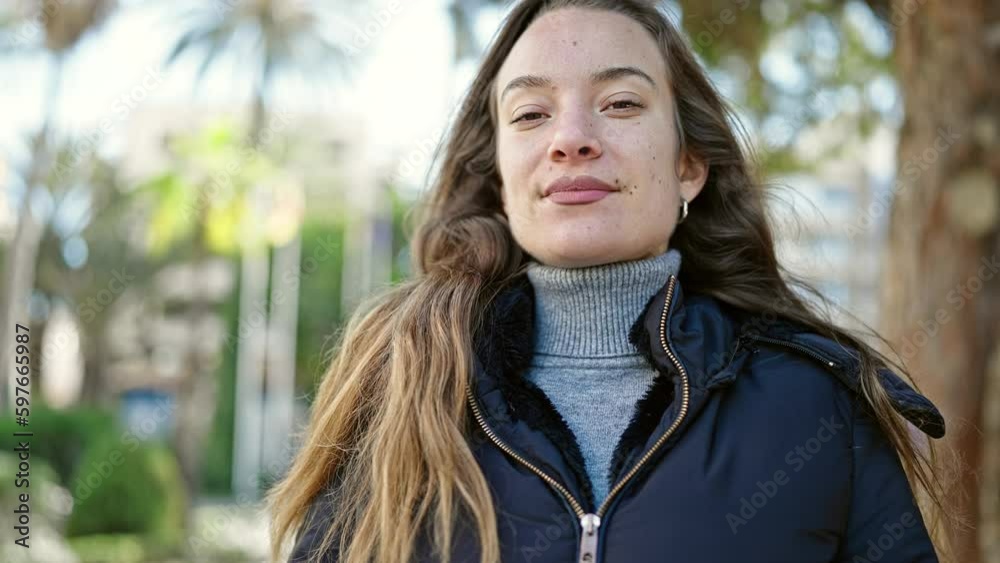 Young caucasian woman smiling confident breathing at park Young caucasian woman smiling confident breathing at park