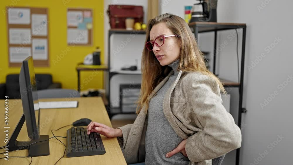 Young caucasian woman business worker suffering for backache working at office