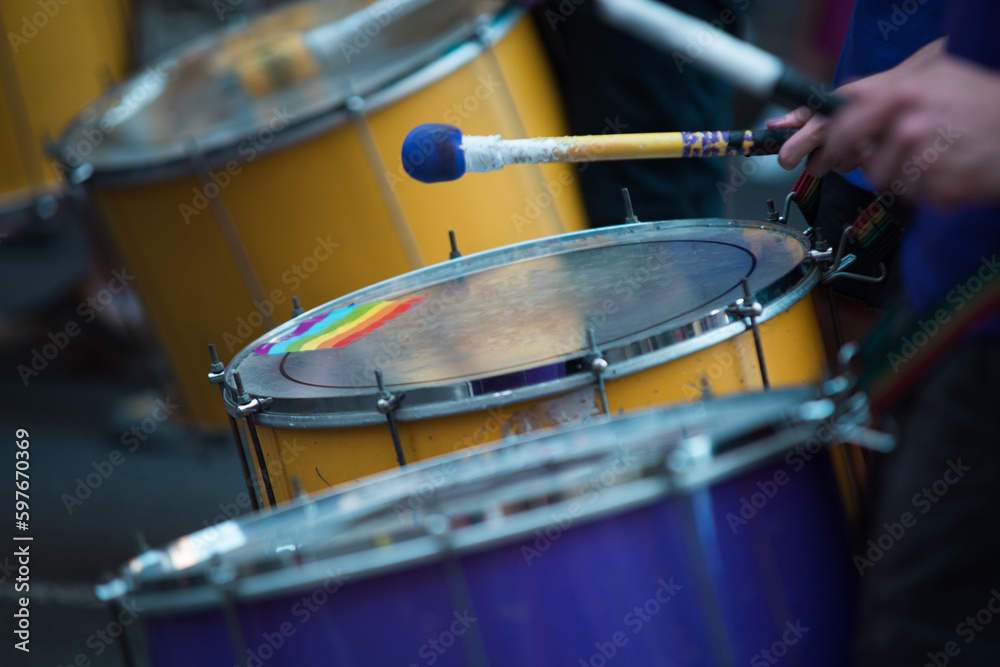 Detail of musicians drumming during the gay pride parade. Detail of musicians drumming during the gay pride parade.