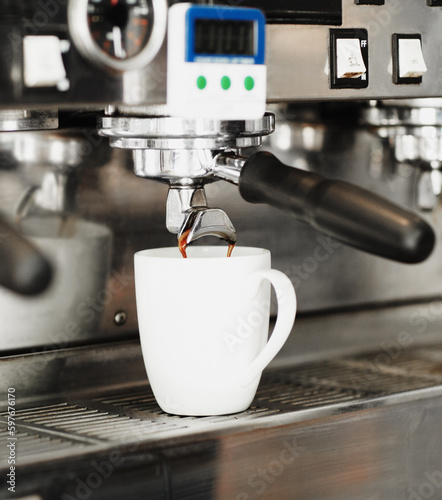 Pouring coffee, cup and machine in cafe for cappuccino, latte beverage or hot drink. Restaurant, electrical appliance and caffeine mug for making or brewing espresso in retail shop or small business.