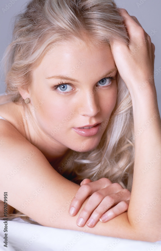 Beauty, closeup and portrait of woman on bed for sensual, makeup and attractive. Relax, cosmetics and glamour with face of female model in studio for desire, sensuality and elegant style Beauty, closeup and portrait of woman on bed for sensual, makeup and attractive. Relax, cosmetics and glamour with face of female model in studio for desire, sensuality and elegant style