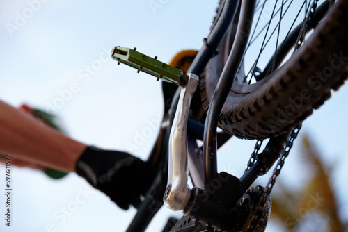 Closeup, bicycle and low angle with wheel, chain and pedal for sport, fitness and workout in nature. Below mountain bike, tire and outdoor for race, sports adventure or eco friendly transportation