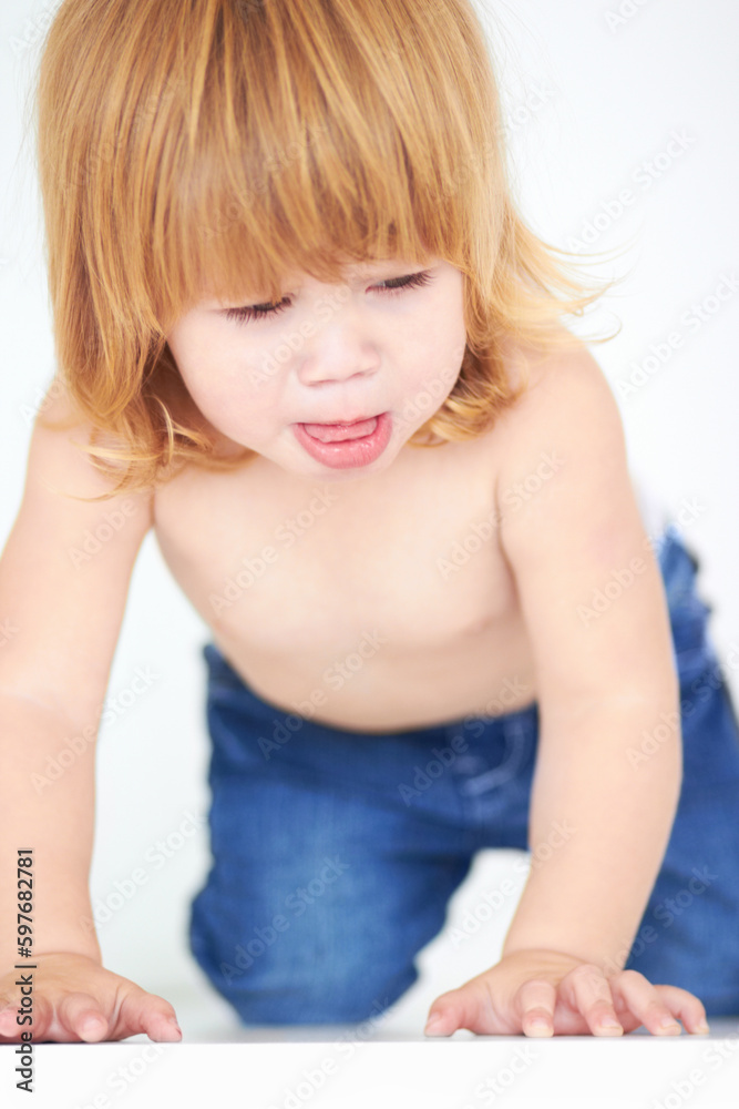Cute, crawling and learning with baby on floor for curious, sweet and child development. Growth, youth and health and adorable with young toddler on ground in studio for childhood, innocent or active Cute, crawling and learning with baby on floor for curious, sweet and child development. Growth, youth and health and adorable with young toddler on ground in studio for childhood, innocent or active