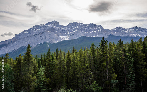 Landscape in the Rocky Mountains. amazing nature view - sharp stone mountain peaks, coniferous forest. Travel and tourism concept image, selective focus. © joi