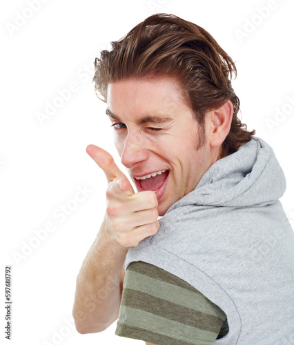 Pointing, wink and portrait of man in studio for finger gun, approval and choice. Confident, happy and smile with male and hand gesture isolated on white background for success, yes and thank you