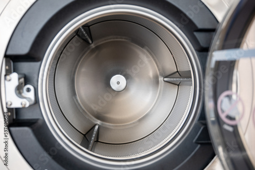 Close up brand new drum material metal electrical household appliance, Inside of washing machine tub is made of stainless steel, Empty inside