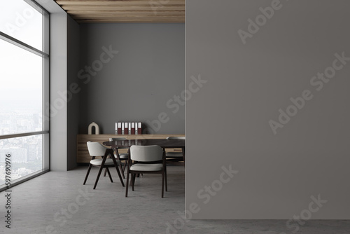 Grey business room interior with meeting table and panoramic window, mockup wall