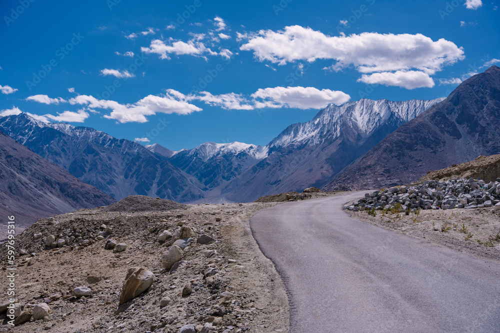 road with two sides are high mountains, and blue sky. Beautiful scenery on the way to pangong lake, Leh, Ladakh, Jammu and Kashmir, India