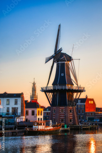 The Binnen Spaarne Canal Running through Haarlem, the Netherlands, with the Famous Windmill De Adriaan, in the Afternoon Sun