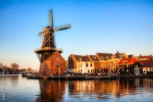 The Binnen Spaarne Canal Running through Haarlem, the Netherlands, with the Famous Windmill De Adriaan, in the Afternoon Sun