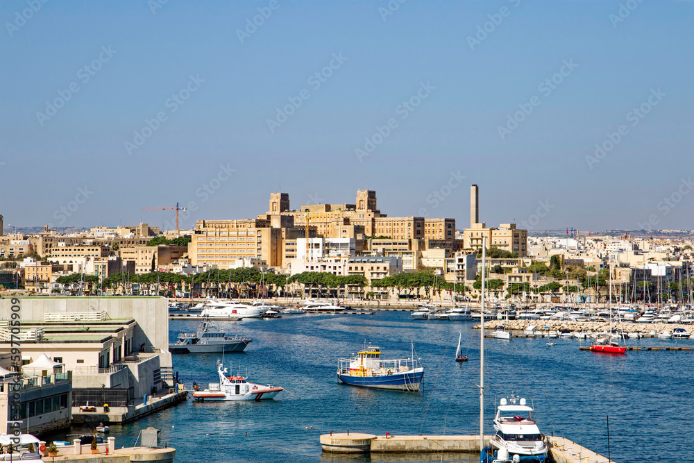 Scenic view of port of City of Valletta with marina, skyline and Mediterranean Sea at Malta island on a sunny hot summer day. Photo taken August 9th, 2017, Valletta, Malta.