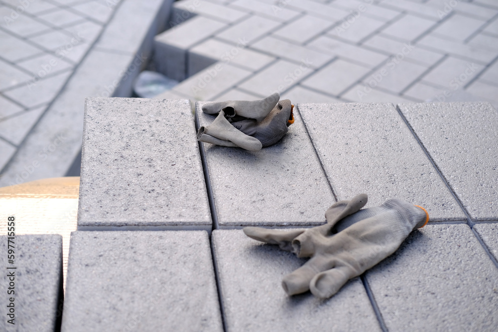 gray paving blocks on the ballast, side view, construction site of