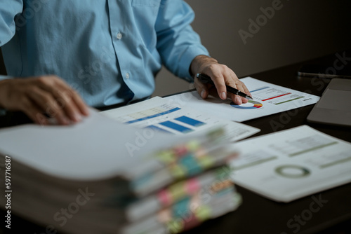 portrait of a man Working on tablet computer in modern office make account analysis report Real estate investment information, financial and tax system concept