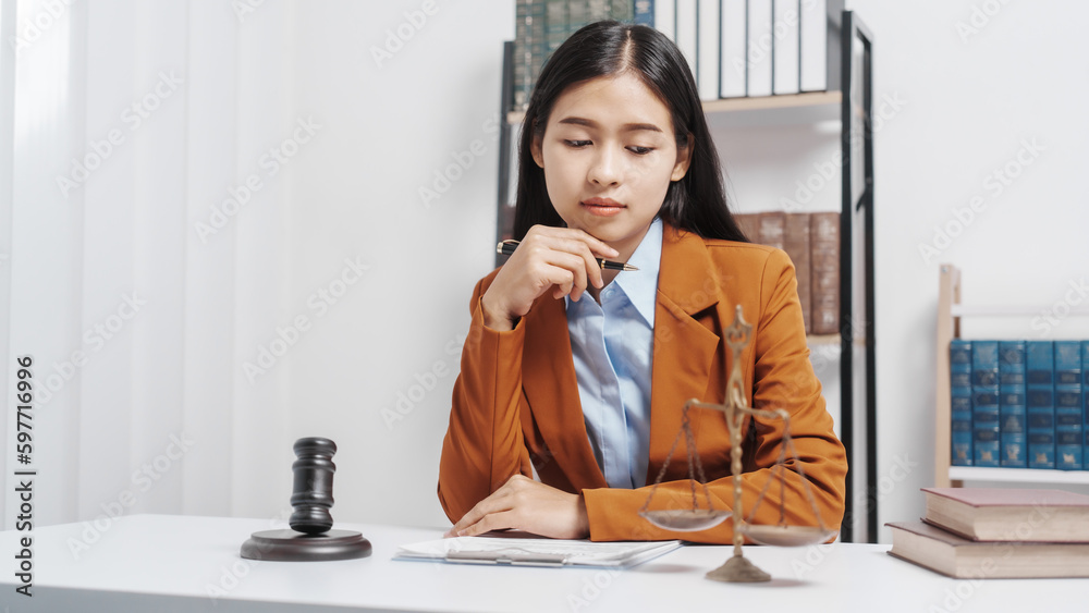 Young single female lawyer asian people in formal suit real estate working law book and contract documents, Arguments for Defense Strategy. Fight for Freedom. Supporting Evidence. Young single female lawyer asian people in formal suit real estate working law book and contract documents, Arguments for Defense Strategy. Fight for Freedom. Supporting Evidence.