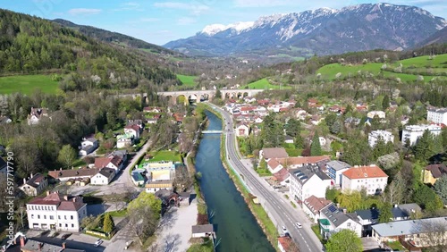 The village Payerbach in Austria with the Schwarza river and the Semmeringbahn railway viaduct crossing the river photo