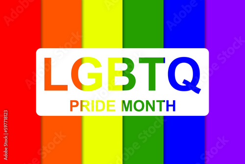 LGBTQIA PRIDE MONTH Text on a bright rainbow flag, a pride month for lesbian, gay, bisexual, transgender, human rights and tolerance.