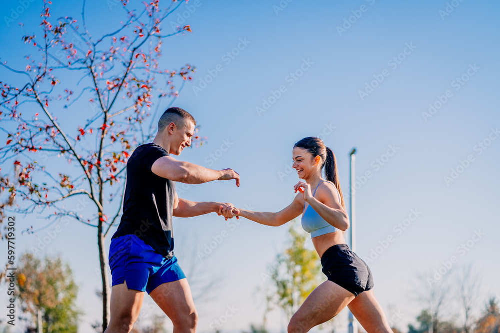 Sexy couple working out in the park together Sexy couple working out in the park together