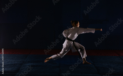 Teen girl working out karate