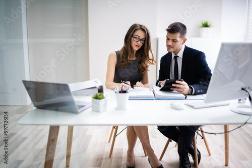 Two Business People Doing Finance Work