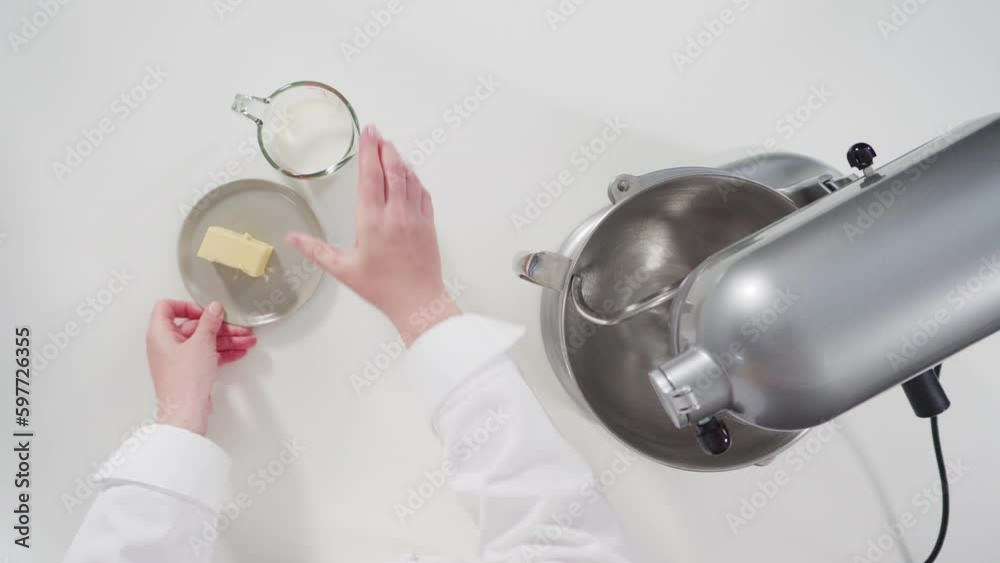 Flat lay. Mixing ingredients in a kitchen standing mixer to bake cinnamon rolls. Flat lay. Mixing ingredients in a kitchen standing mixer to bake cinnamon rolls.