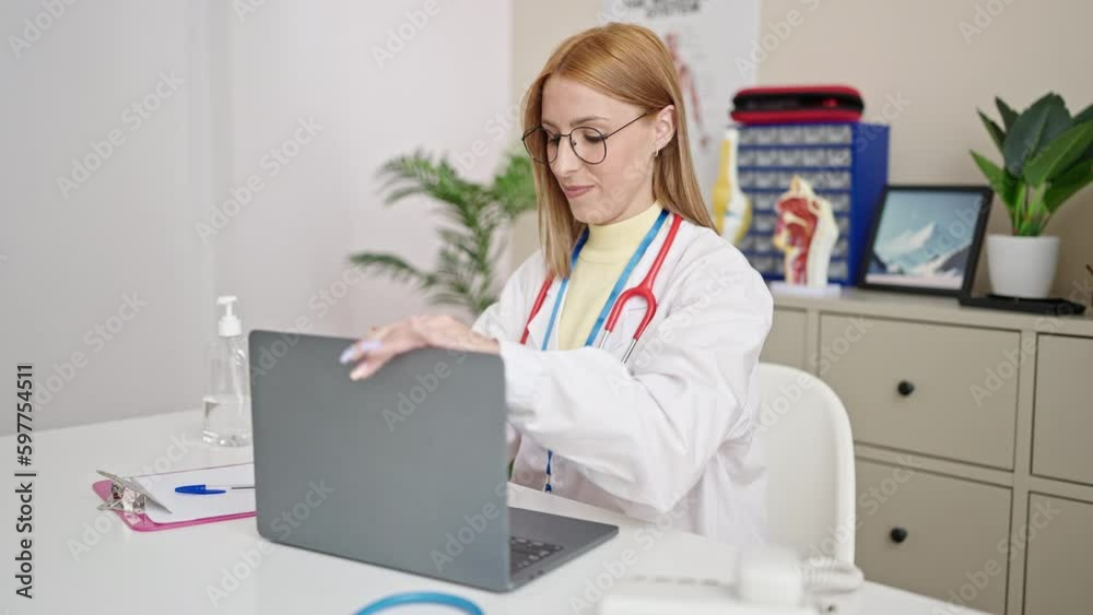 Young blonde woman doctor stressed working at clinic Young blonde woman doctor stressed working at clinic