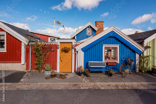 Row of ancient colorful wooden houses in the city of Karlskrona, Sweden photo