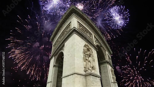 Celebratory fireworks over the Arc de Triomphe ( 4K, time lapse), Paris, France. The walls of the arch are engraved with the names of 128 battles and names of 660 French military leaders (in French)  photo