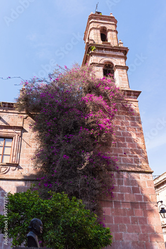 bell tower at corner of landmark clavijero cultural center building of baroque architectural style in morelia mexico photo