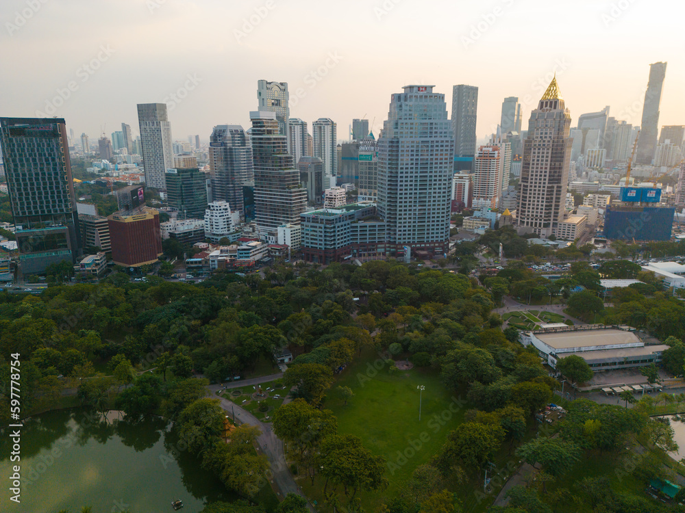 Obraz premium Lumpini park with office building in Bangkok city central of Thailand
