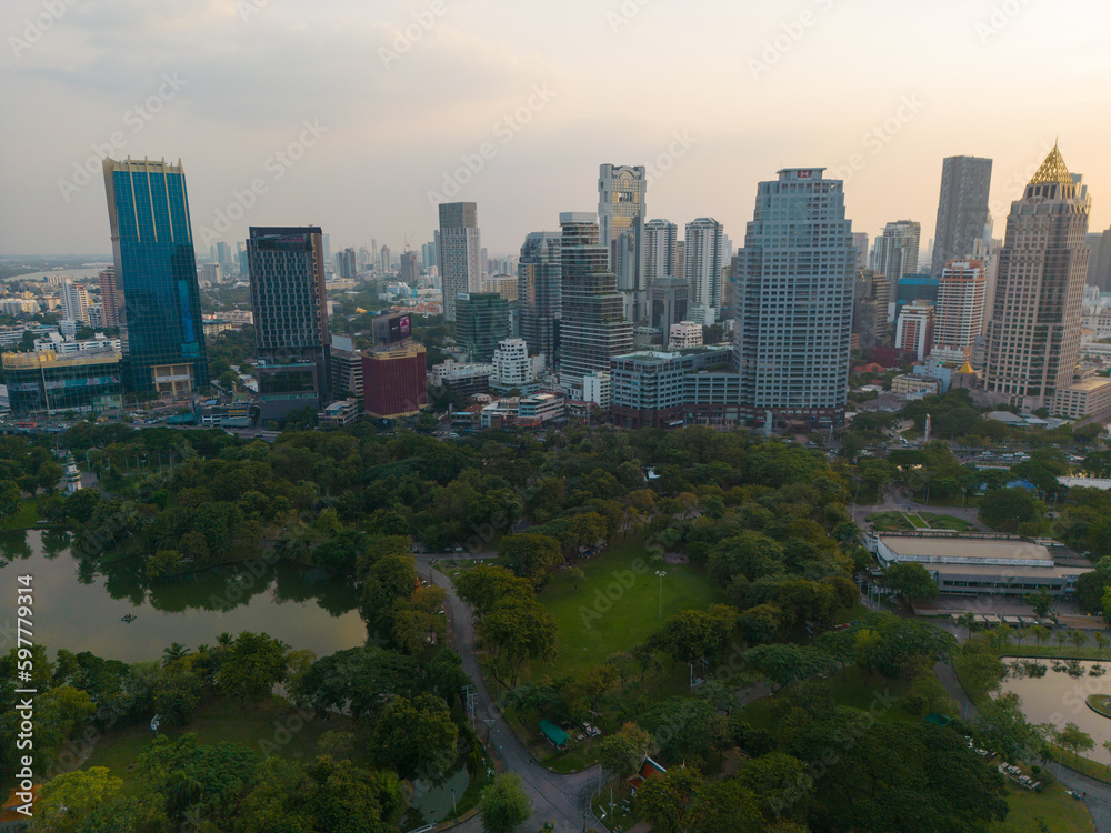 Obraz premium Lumpini park with office building in Bangkok city central of Thailand