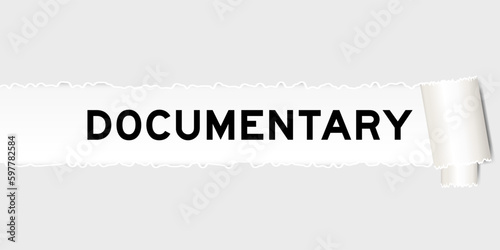Ripped gray paper background that have word documentary under torn part