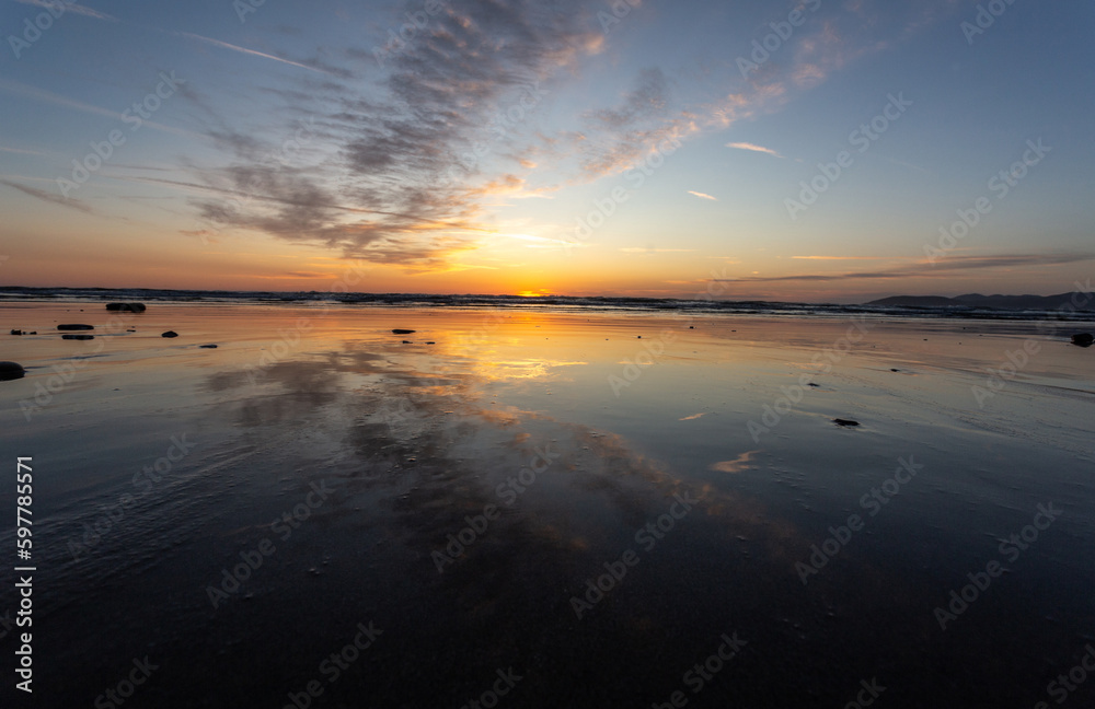 A view on the Pacific ocean shore at sunset