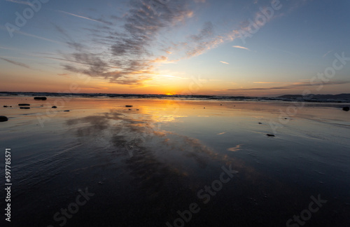 A view on the Pacific ocean shore at sunset