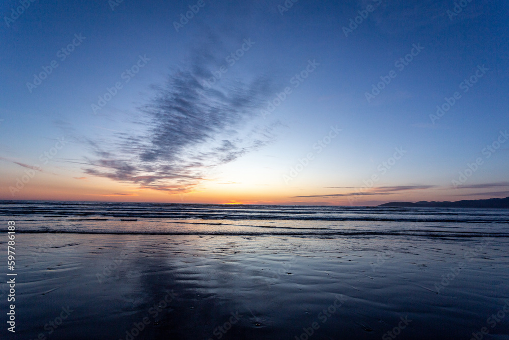 A view on the Pacific ocean shore at sunset