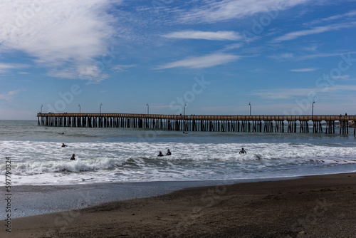 A view on the pier on the Pacific coast at sunset