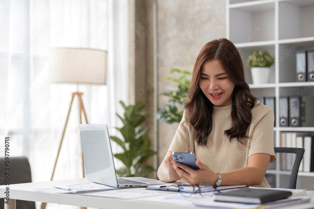 Portrait of smiling beautiful business asian woman working in office use computer with copy space. Business owner people sme freelance online marketing e-commerce telemarketing, work from home concept