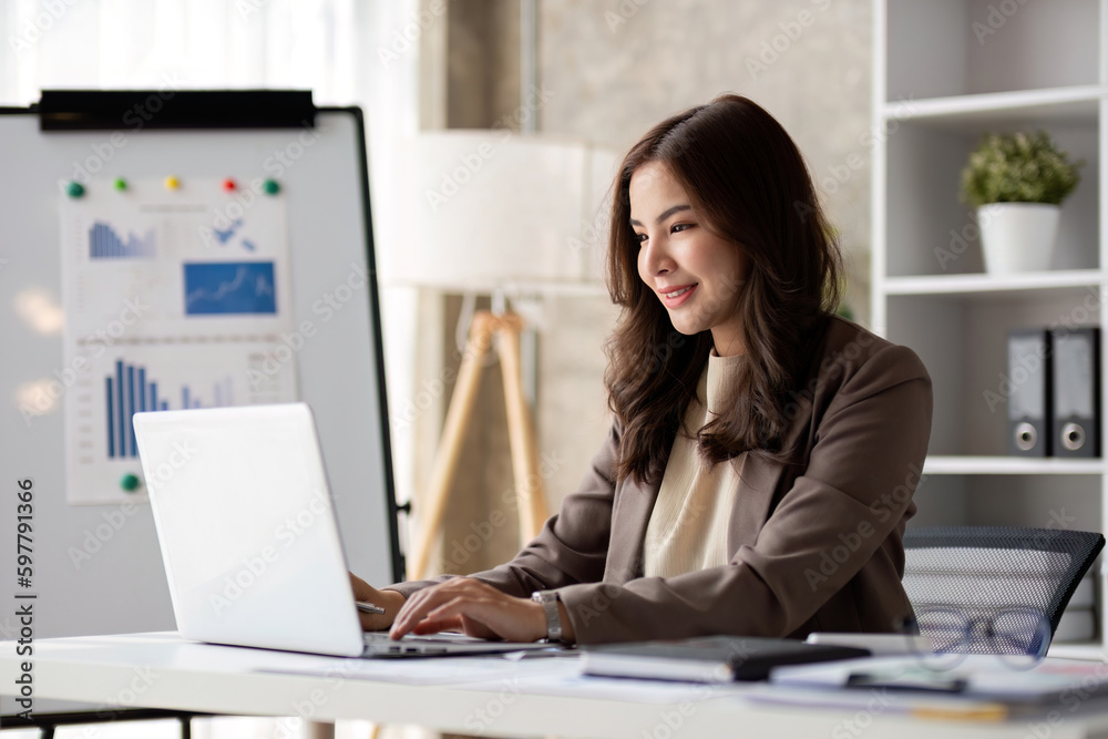 Business woman using calculator for do math finance on wooden desk in office and business working background, tax, accounting, statistics and analytic research concept.. Business woman using calculator for do math finance on wooden desk in office and business working background, tax, accounting, statistics and analytic research concept..