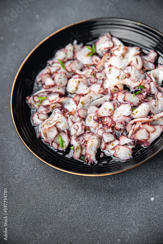 octopus carpaccio marinated seafood salad healthy meal food snack on the table copy space food background rustic top view