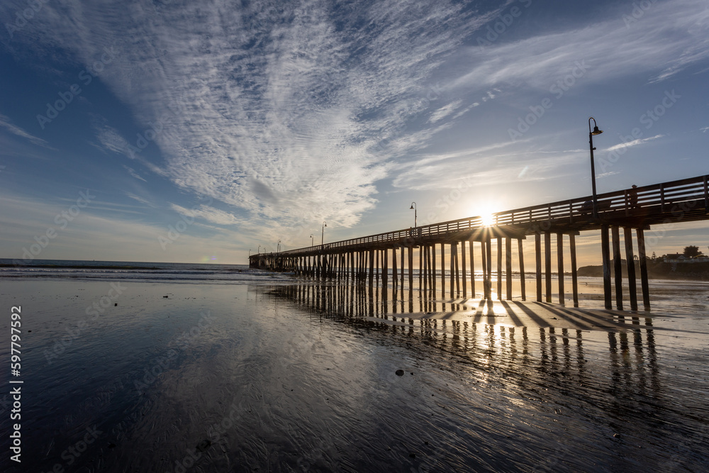 A view on the pier on the Pacific coast at sunset