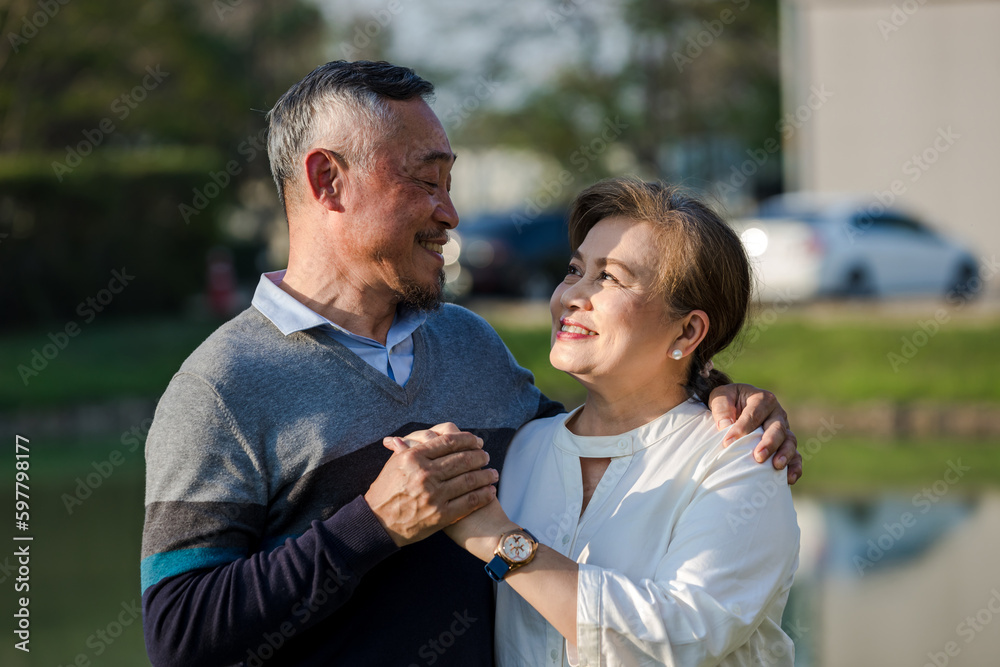 Fototapeta premium Asian Elderly couple. Happy senior couple in love. elderly couple smiling while being in a great mood. Elderly couple embracing