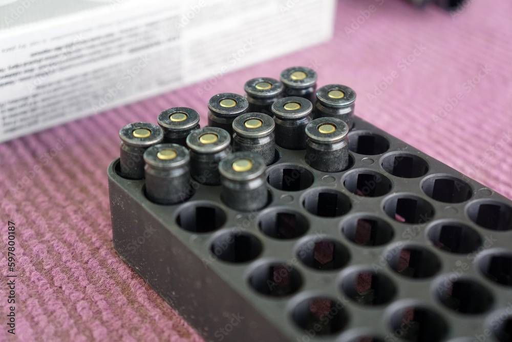 9mm black practice ammunition in box. 9mm bullets in the plastic box.