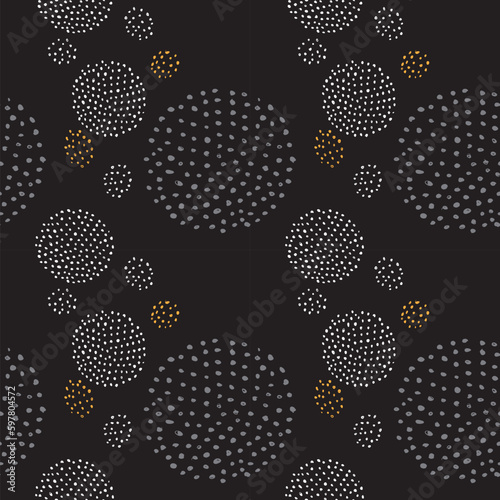 A strict seamless pattern handwritten drawing with lots of circles and dots. Hand drawing in black and white, vector for products and textiles
