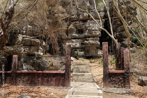 The atmosphere at Batu Cermin  one of the tourist destinations in Labuan Bajo  East Nusa Tenggara  Indonesia. There are caves with stalagmites and stalactites and arid conditions around them.