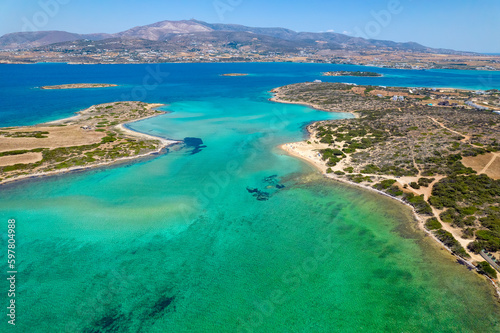 Aerial view of the amazing colorful turquise waters of Antiparos island, cyclades Greece.