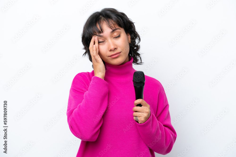 Young Argentinian singer woman isolated on white background with headache Young Argentinian singer woman isolated on white background with headache