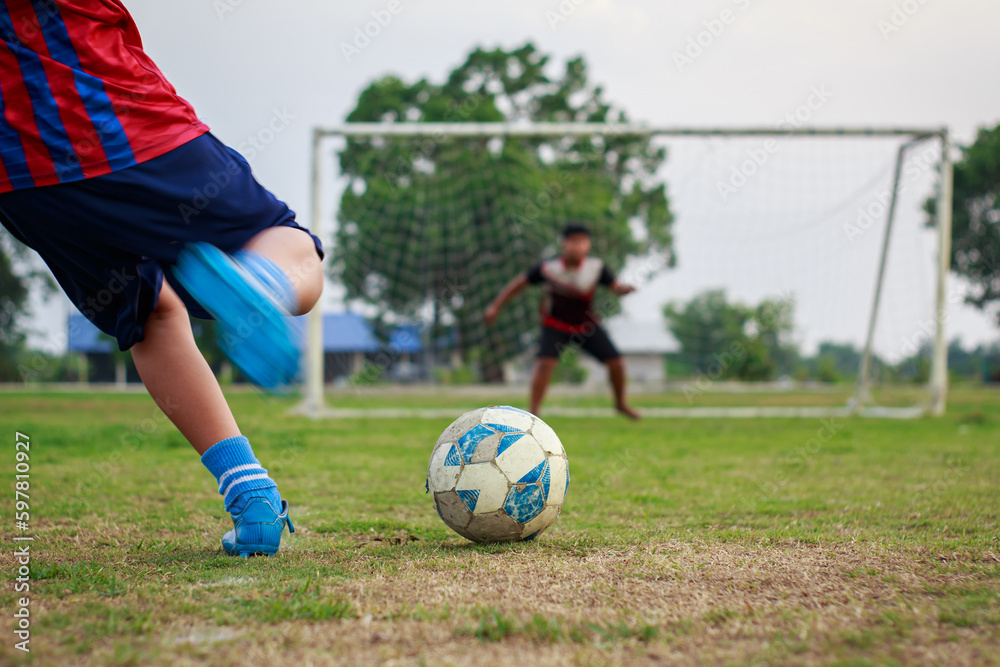 Foto de Action sport of a group of kids playing soccer football for